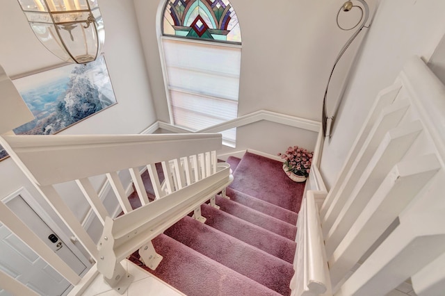 stairs featuring tile patterned floors