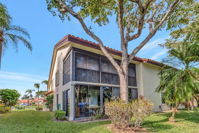 rear view of property with a yard