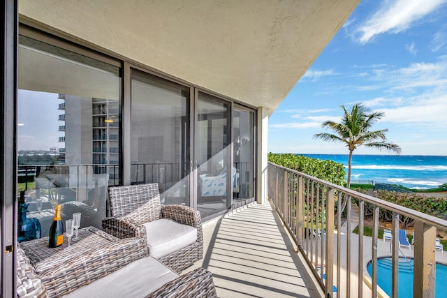 balcony featuring a water view