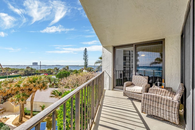 balcony featuring a water view