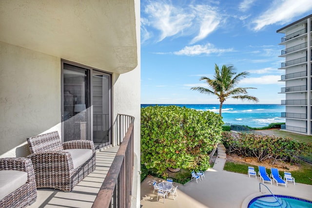 balcony featuring a water view