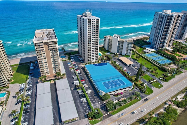 aerial view with a water view and a view of the beach