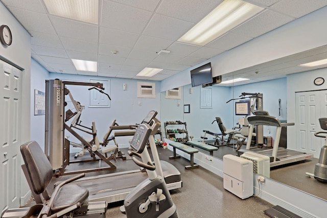 exercise room featuring a paneled ceiling