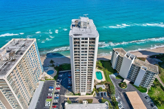 aerial view featuring a view of the beach and a water view