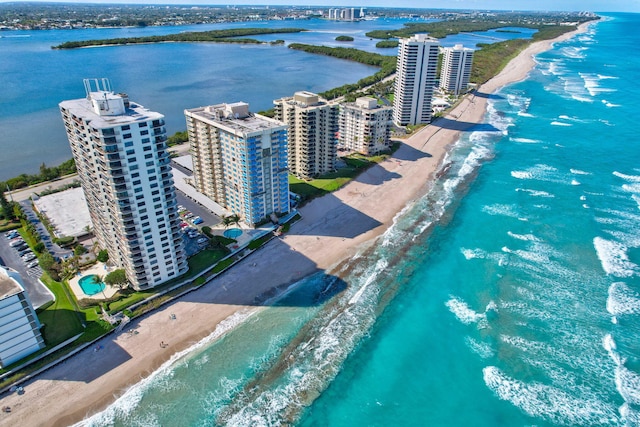 aerial view featuring a water view and a beach view