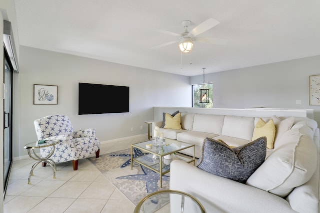 living room with ceiling fan and light tile patterned flooring