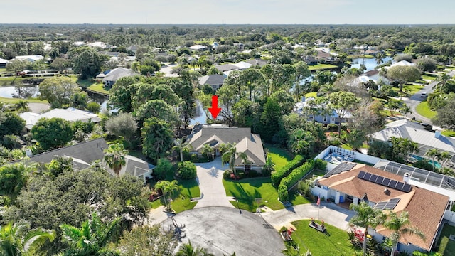 bird's eye view featuring a water view and a residential view