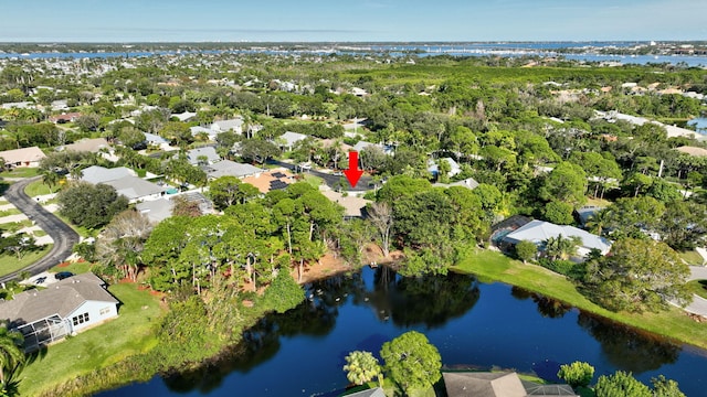 birds eye view of property with a water view and a residential view