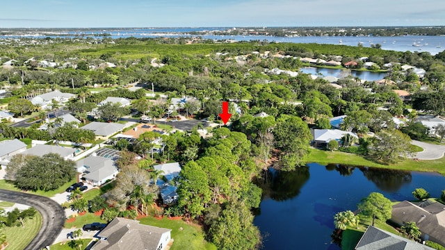 birds eye view of property with a residential view and a water view