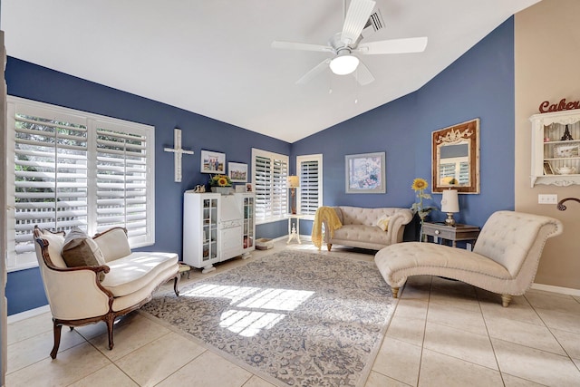 interior space featuring vaulted ceiling, baseboards, and ceiling fan