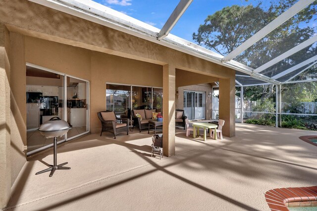 view of patio with a lanai and outdoor lounge area