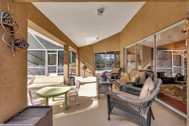 sunroom featuring lofted ceiling