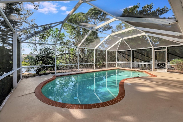 outdoor pool with a patio area