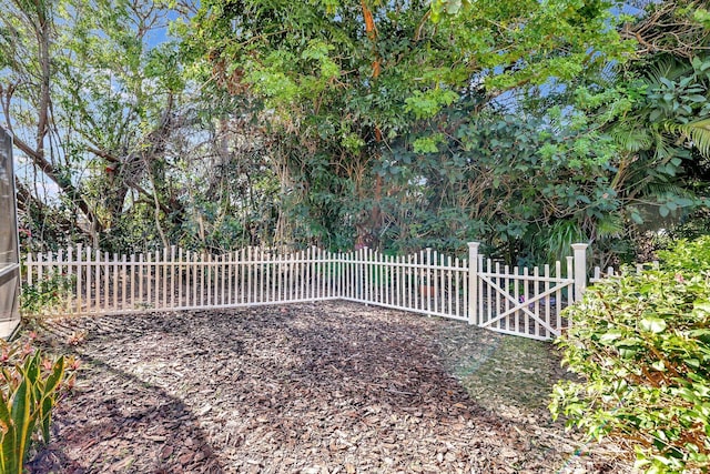 view of gate with fence