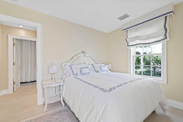 bedroom with light hardwood / wood-style flooring