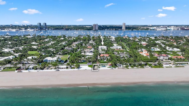 aerial view with a water view and a view of the beach