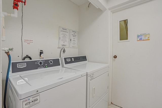 laundry room with independent washer and dryer