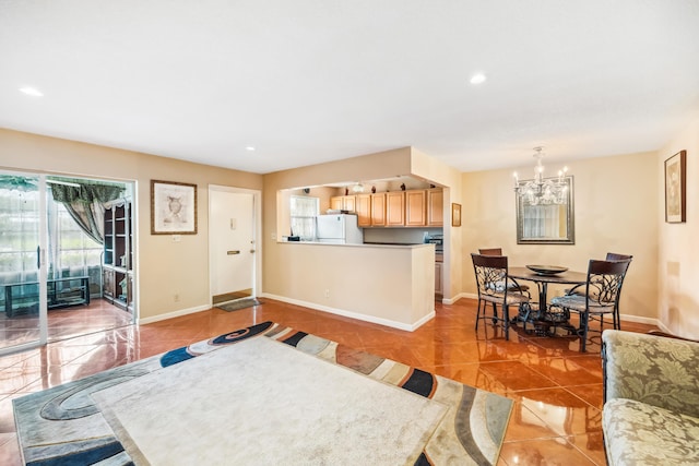 tiled dining area featuring a notable chandelier