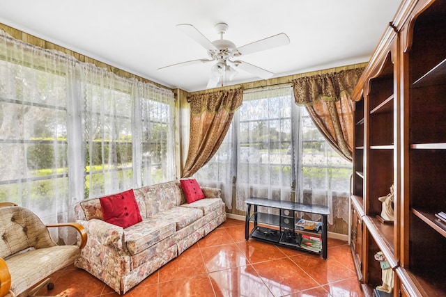 sunroom featuring ceiling fan