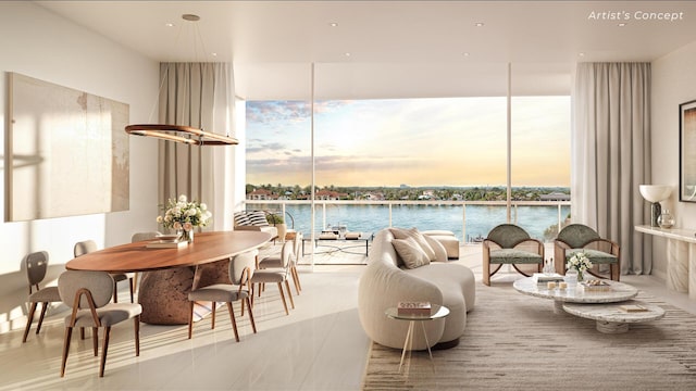 interior space featuring floor to ceiling windows, a water view, and plenty of natural light