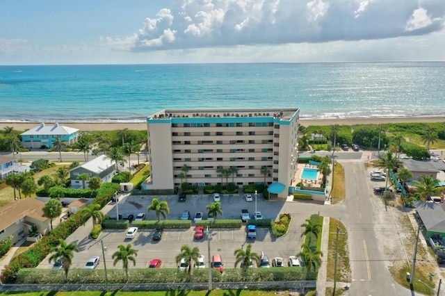 bird's eye view with a beach view and a water view