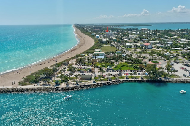 drone / aerial view with a view of the beach and a water view