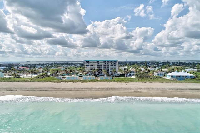 bird's eye view featuring a beach view and a water view