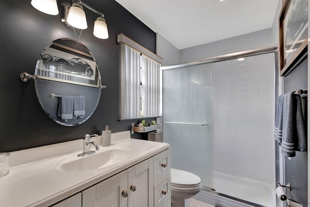 bathroom with vanity, toilet, and walk in shower