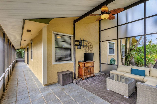 view of patio with ceiling fan and an outdoor hangout area