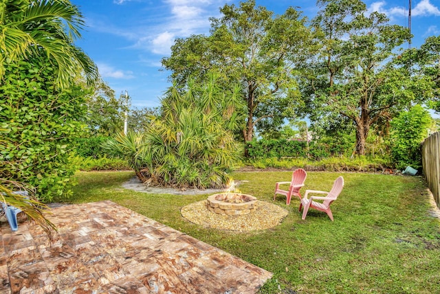 view of yard featuring a patio and a fire pit