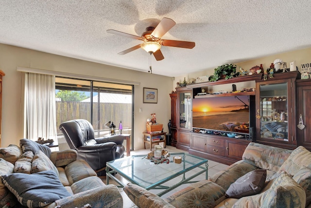 tiled living room featuring a textured ceiling and ceiling fan