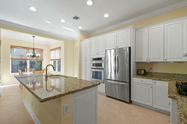 kitchen with white cabinets, appliances with stainless steel finishes, and sink