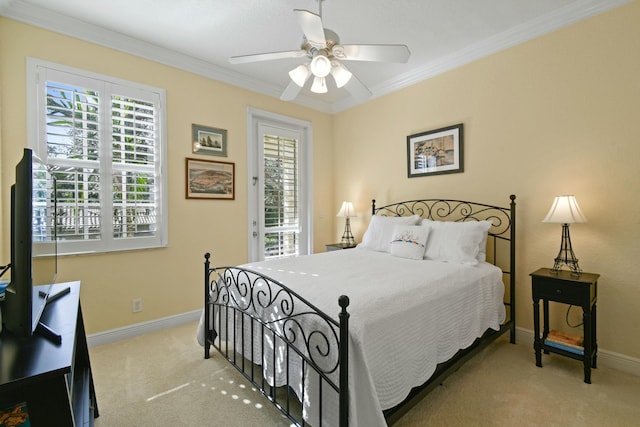 carpeted bedroom featuring access to outside, ceiling fan, and ornamental molding