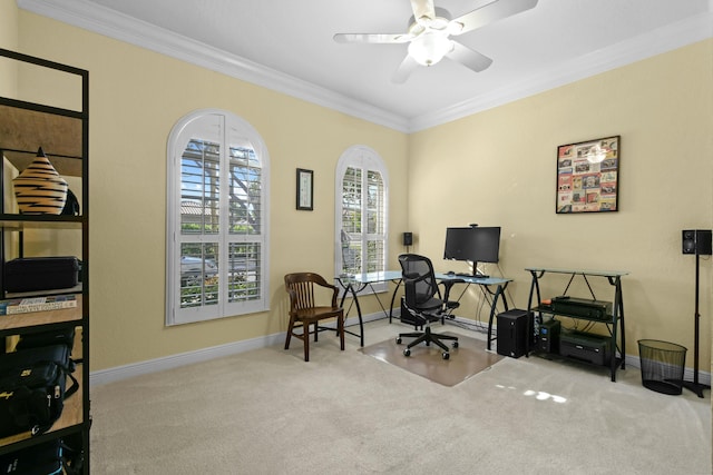 home office with light colored carpet, ceiling fan, and crown molding