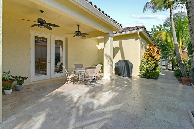 view of patio with french doors, ceiling fan, and a grill