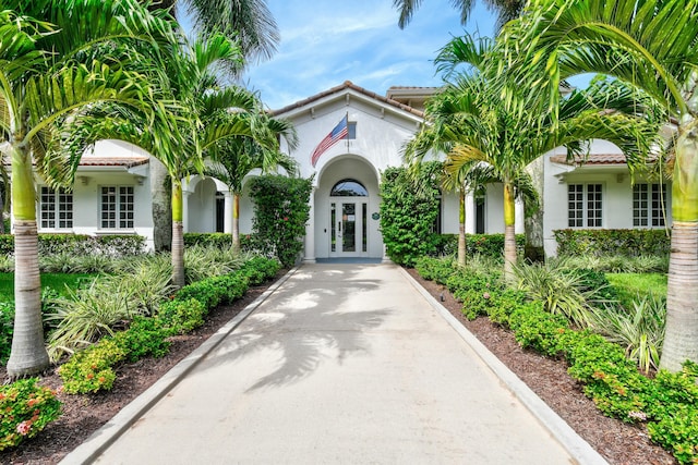 mediterranean / spanish house featuring french doors