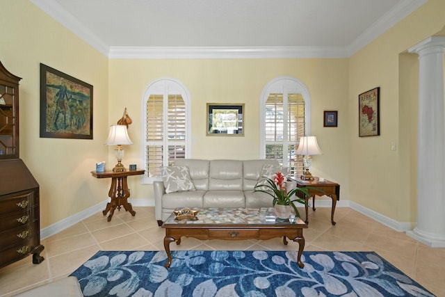 living area with light tile patterned flooring, ornamental molding, and decorative columns