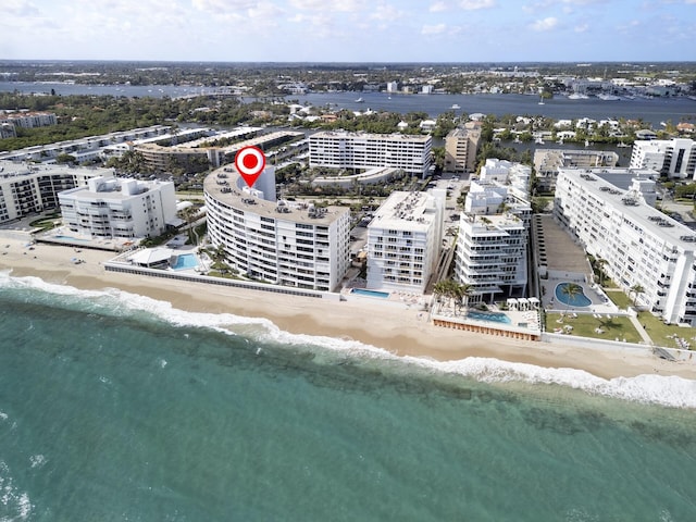 drone / aerial view with a water view and a view of the beach