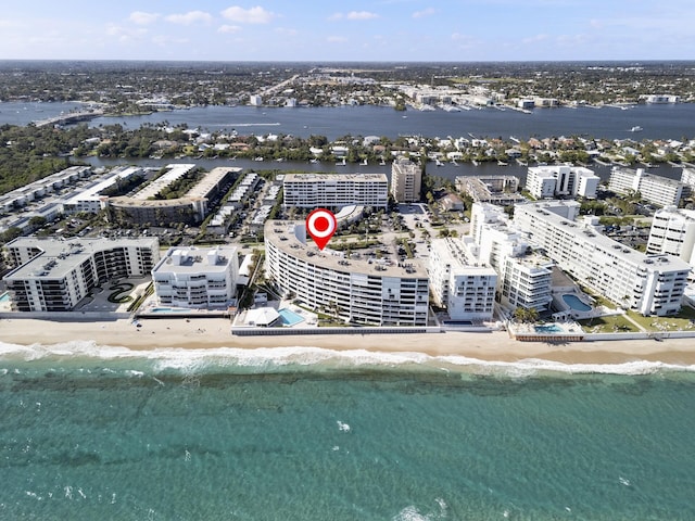 aerial view featuring a water view and a beach view