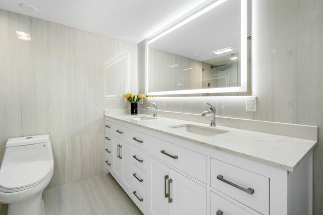 bathroom with toilet and a tile shower