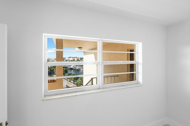 unfurnished room featuring plenty of natural light