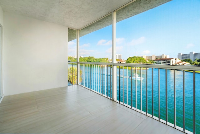 balcony featuring a water view