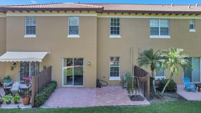 back of property with a patio area