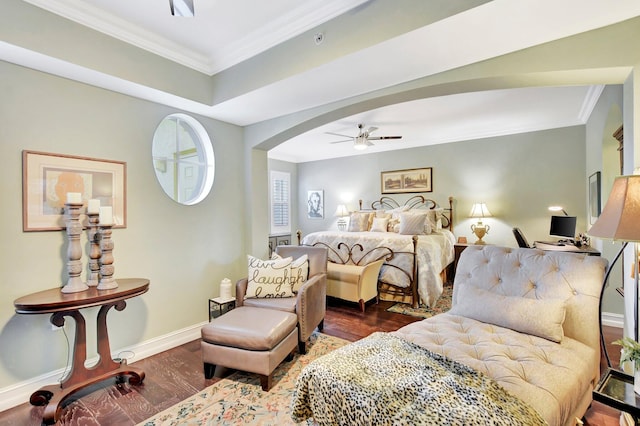 bedroom featuring ceiling fan, crown molding, and dark hardwood / wood-style floors