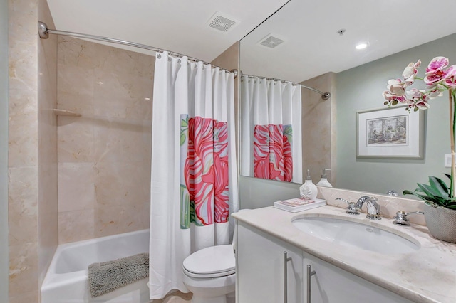 full bathroom with shower / tub combo, vanity, and toilet