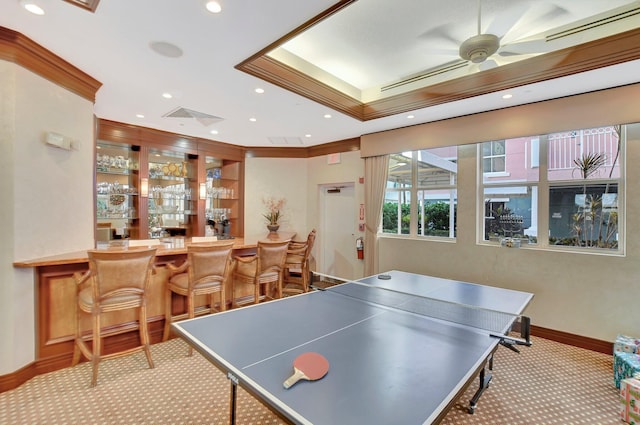 playroom with ornamental molding, indoor bar, ceiling fan, and light carpet