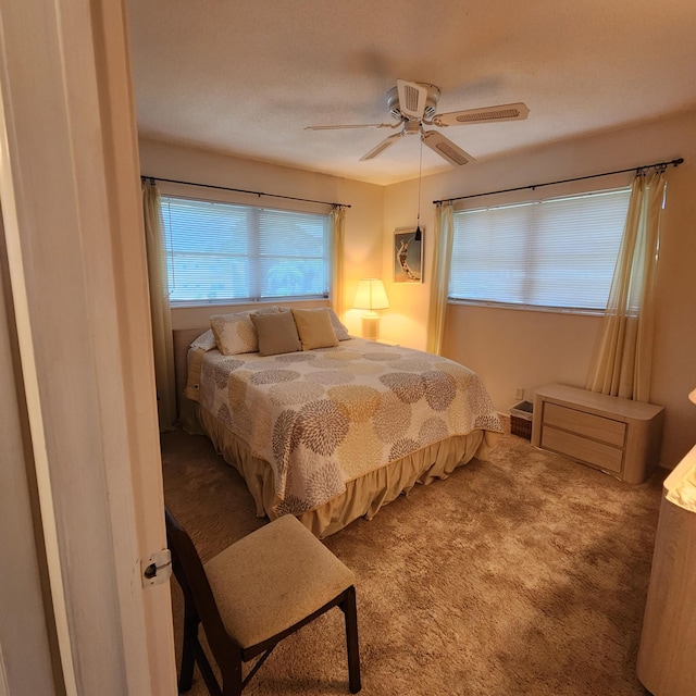 bedroom featuring ceiling fan and carpet floors