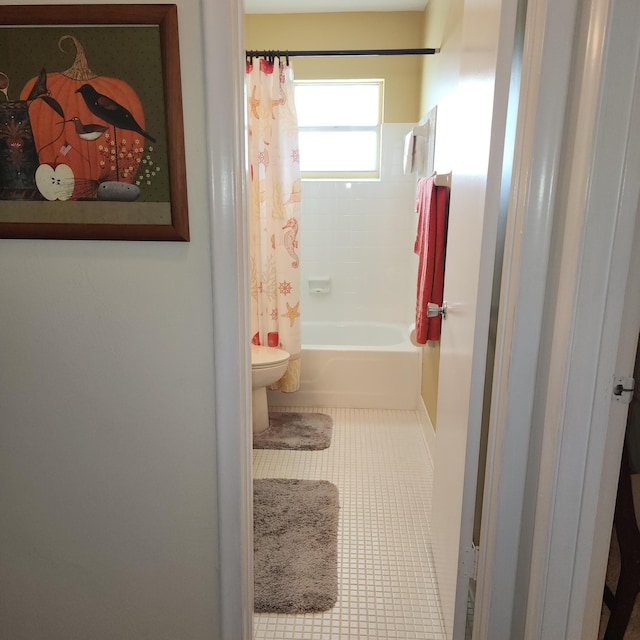 bathroom with tile patterned flooring, toilet, and shower / bath combo with shower curtain