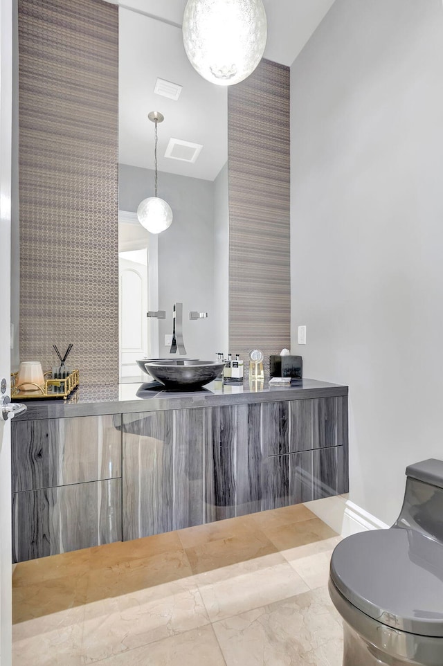 bathroom featuring vanity and toilet