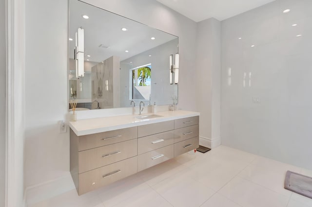 bathroom featuring tile patterned flooring, vanity, and a shower with shower door